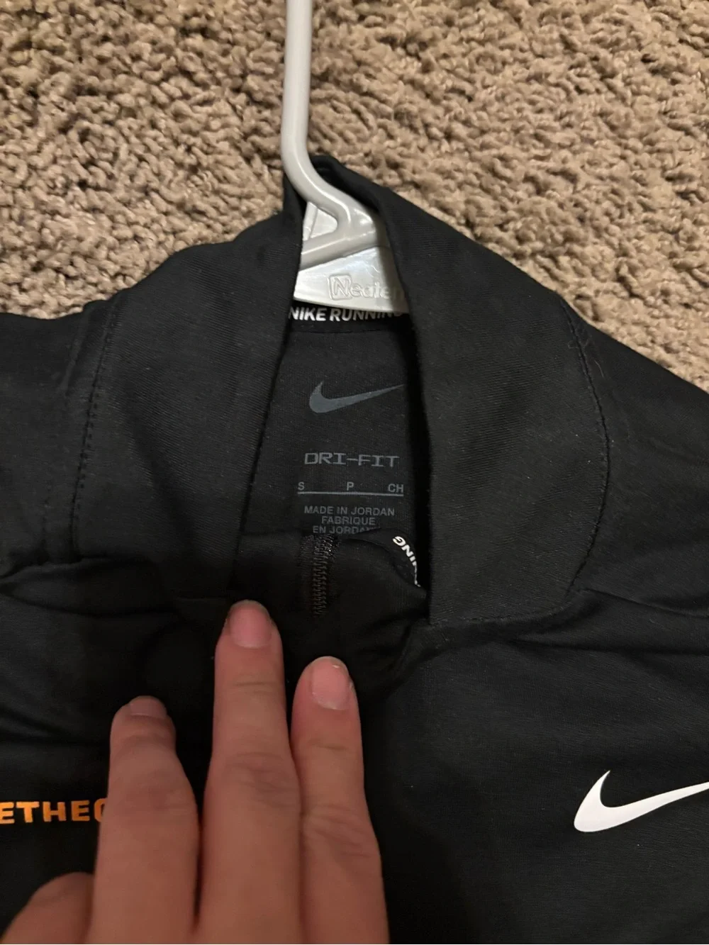 Nike Black Quarter-Zip Running Top with White Swoosh and Orange Accent